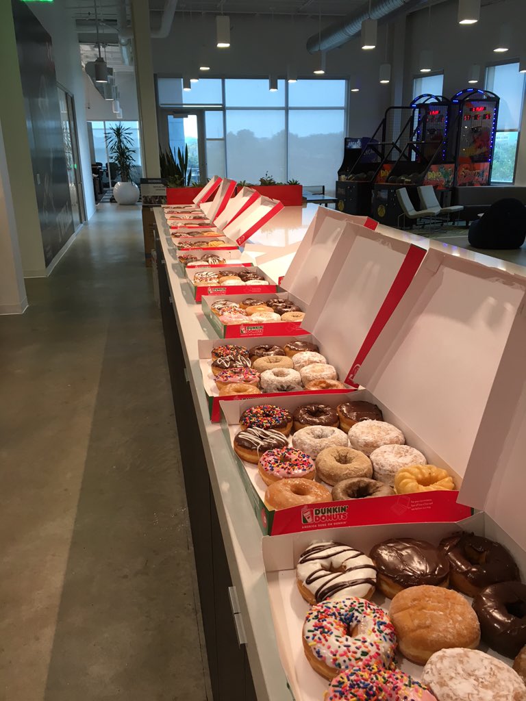 Row of donut boxes on a counter